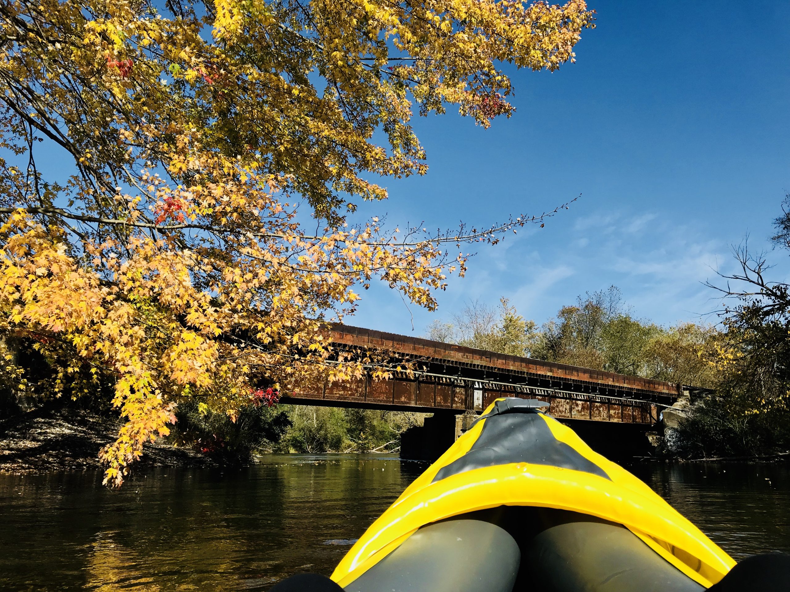 Person kayaking on the Huron River in Ann Arbor, Michigan